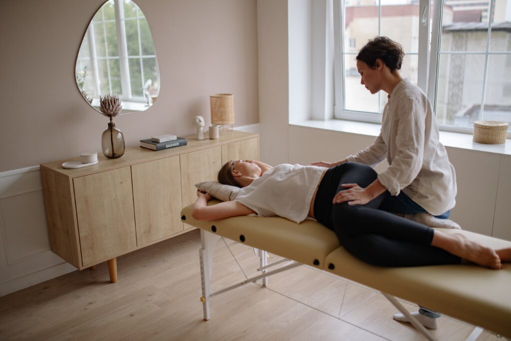 An image of a woman receiving chiropractic treatment